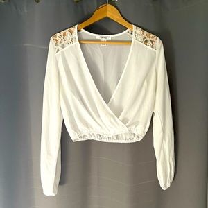 Off-white lace shoulder wrap look blouse